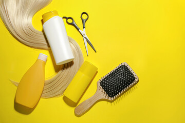 Composition with bottles of hair cosmetics on color background