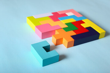 Multicolored puzzle, cubes on a blue background