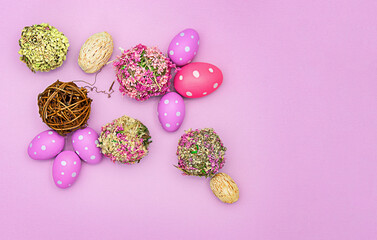 Bright colored easter eggs on a colorful background with flower balls
