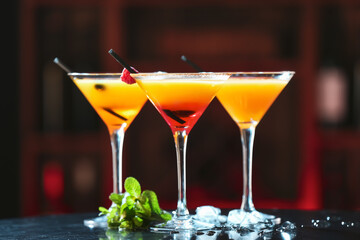 Tasty mango cocktails on table in bar