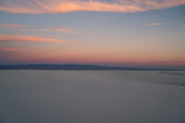 Fototapeta na wymiar Sunset in empty white sand valley