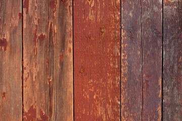 Old wooden background. Colorful planks with scratched paint. Weathered wood close up.