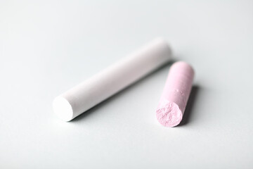 Soft pastels on bright background. Close up. Copy space.