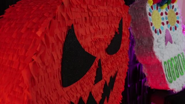 Big pi&ntilde;atas for Halloween and Day of the Dead (d&iacute;a de muertos). Pumpkin and skull.