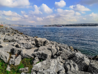 Stone embankment of the Bosporus in Istanbul (Turkey). Large granite boulders on the seashore...