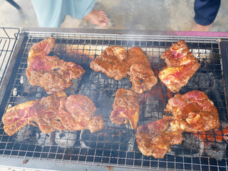 Marinated mutton with spices, grilled and smoked using controlled charcoal fire.