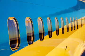 Airplane Windows on Blue Airliner