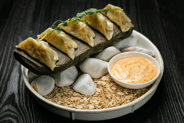 Japanese dumplings on a dark table in a Japanese restaurant