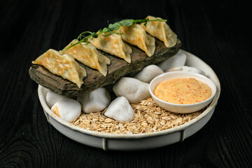 Japanese dumplings on a dark table in a Japanese restaurant