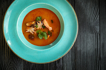 Tom yang with seafood on a table