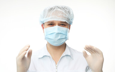 The surgeon wears gloves before surgery. Close-up.