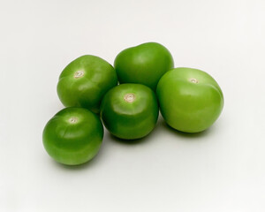 Fresh organic green tomatillos (Physalis philadelphica) on white background