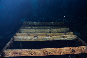 steps under water. The staircase below is hidden under the water. Lake emptied the stairs....