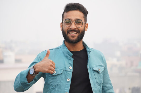 a man showing thumbs up image