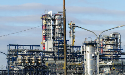 Corps of Moscow refinery in spring in clear weather