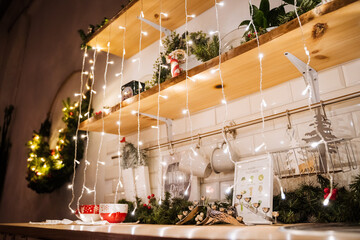small lights garlands hanging on a white wall, taken in the evening, close-up, macro photography