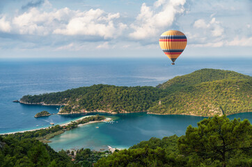 Hot air balloon over beautiful lagoon in Turkey