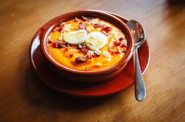 Salmorejo, typical Spanish dish of cold tomato soup with egg and ham