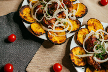 potatoes and grilled shish kebab on a plate