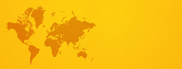 World map on yellow wall background. Horizontal banner