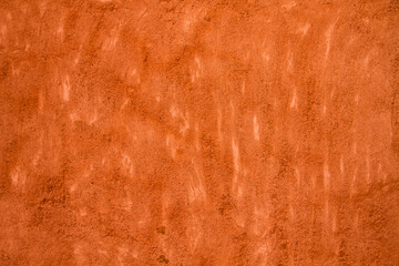 Terracotta colored concrete wall