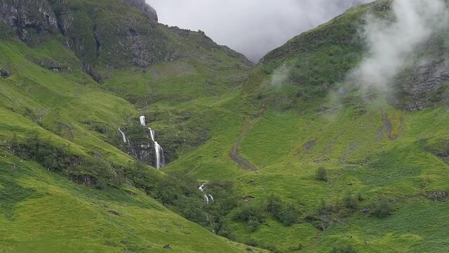 Still slow motion shot of waterfall and mountain hills in Scottish Highlands Scotland United Kingdom 1920x1080 HD