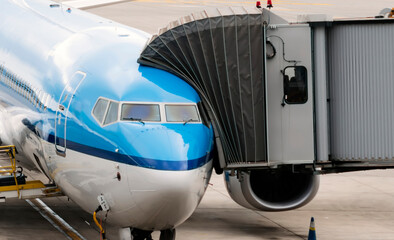 jet bridge attached to the airplane