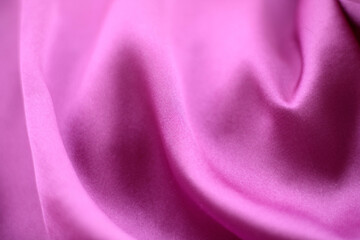 Smooth elegant pink silk or satin texture can use as wedding background. Luxurious background design