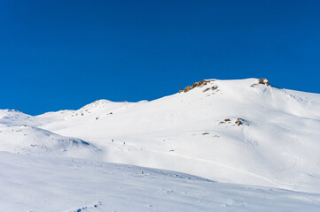 Fototapeta na wymiar Untouched alpine skiing area in Romanian mountains with lots of snow