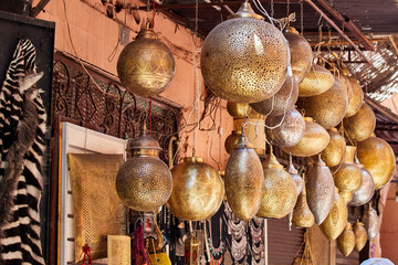 Handcrafted Moroccan Brass Lamps, hanging at a market stall in the souks of Marrakech