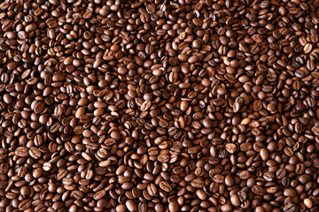 Background from a variety of roasted coffee beans.The texture of coffee beans.