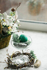 Beautiful green Easter eggs in an Easter composition, a modern symbol