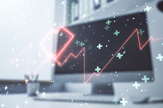 Double exposure of creative abstract heart rate hologram and modern desktop with laptop on background. Healthcare technolody concept