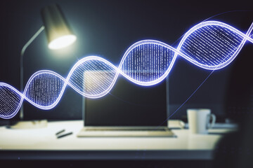 Double exposure of creative DNA hologram on laptop background. Bio Engineering and DNA Research concept