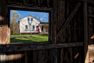 Naklejka premium Looking through the window of an empty damaged barn