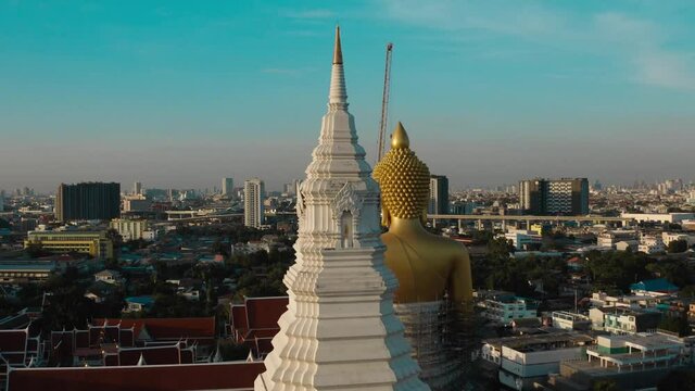 Aerial view of Wat Paknam Bhasicharoen, a temple, pagoda and Buddha statue in Bangkok Thailand. High quality 4k footage