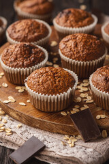 Homemade oat flakes muffins with peanut butter and chocolate.