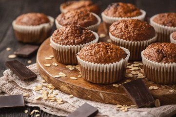 Homemade oat flakes muffins with peanut butter and chocolate.