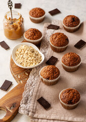 Homemade oat flakes muffins with peanut butter and chocolate.