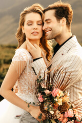 Loving happy couple hugging tenderly in beautiful clothes, romantic relationship