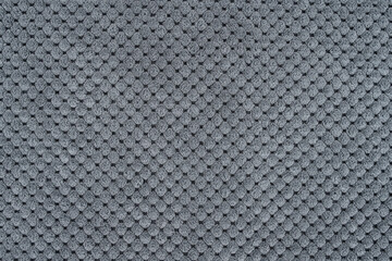 Close-up of a gray textured fabric. Macro shot of gray upholstery for furniture. Wallpaper and background. Close Up grey fabric texture.