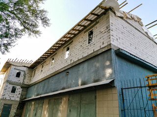 scaffolding on a building wall. building getting a new paint.