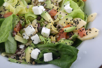 green salad with avocado and mozzarella
