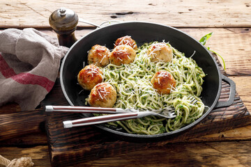 Pasta with meatballs and pesto sauce
