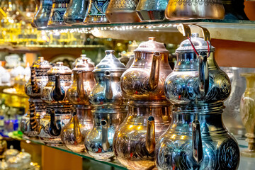 Arab souvenir shop with copper utensils: teapots, coffee pots and other utensils