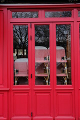 Some chairs stacked at a closed parisian cafe due to the coronavirus pandemic. Paris march 2021.