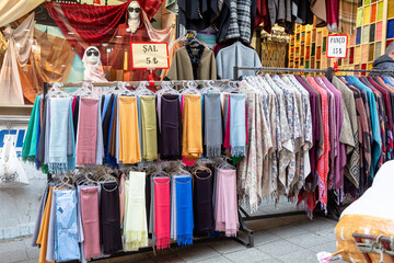 Arab store selling a variety of fabrics, Fabric in rolls