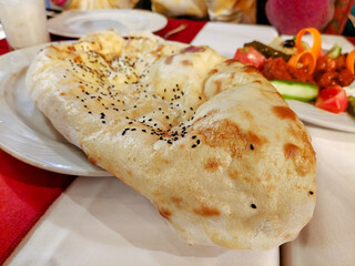 Traditional Arabic bread with spices is on the plate