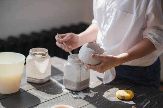 Production Process Of Pottery. Application Of Glaze Brush On Ceramic Ware.