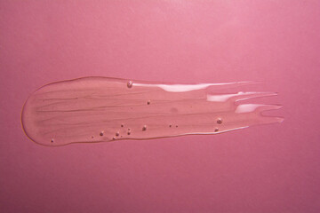 Cosmetic gel product on pink background. Texture and background